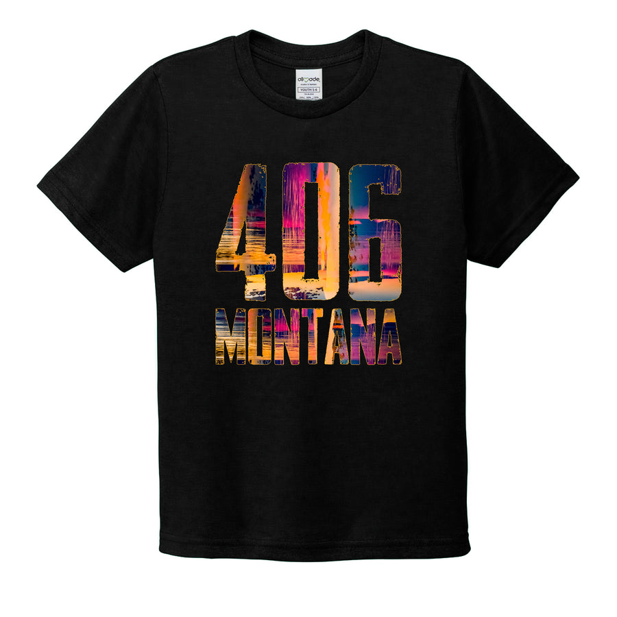 A black youth tshirt laid flat with a vivid 406 Montana design.