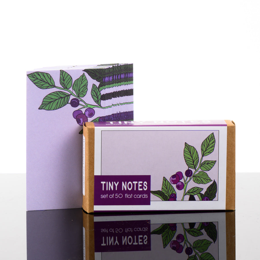 A pack of 50 units of hand drawn huckleberry note cards, made in Montana.