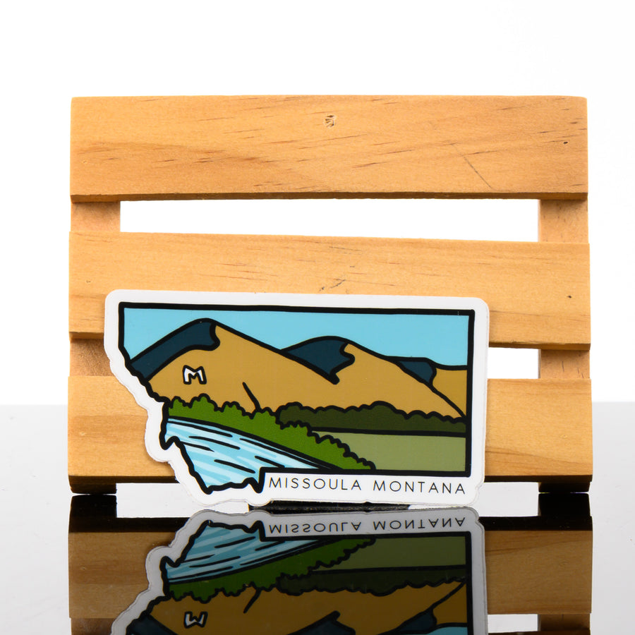 This cute sticker is the shape of Montana and says Missoula, Montana.