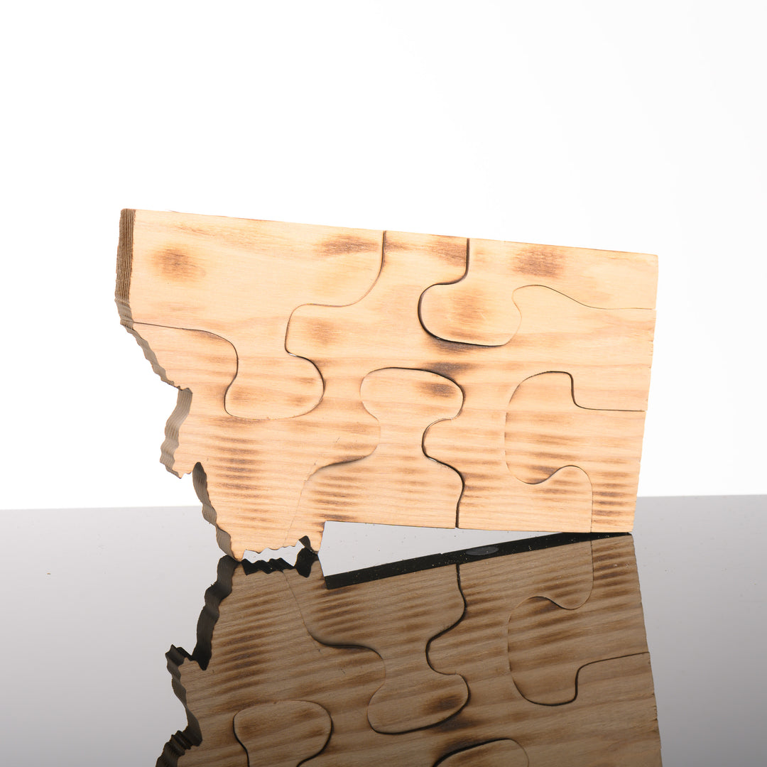 This handmade wood five piece puzzle is in the shape of the state of Montana.