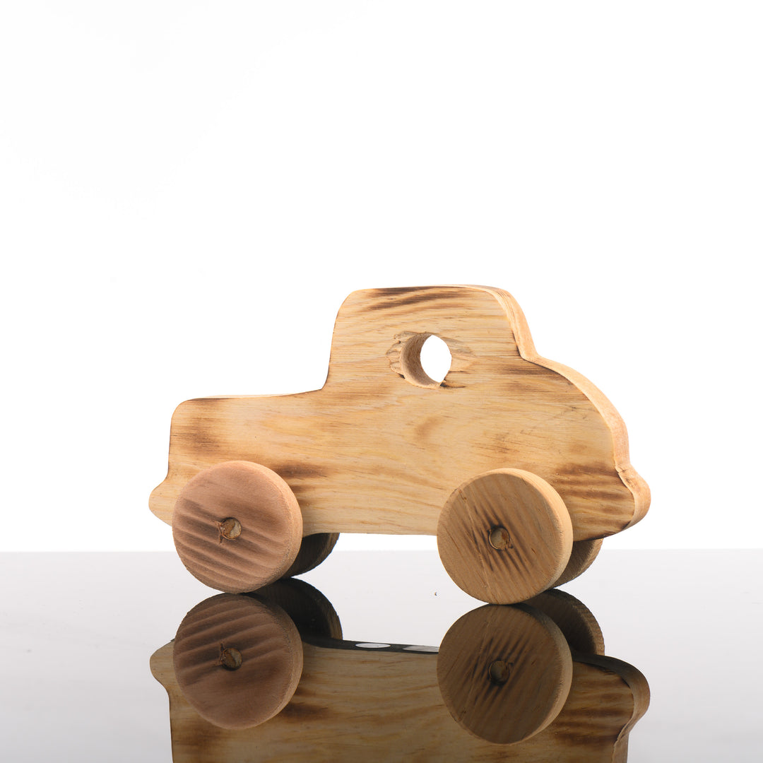 A rustic wooden vintage coupe children's toy.