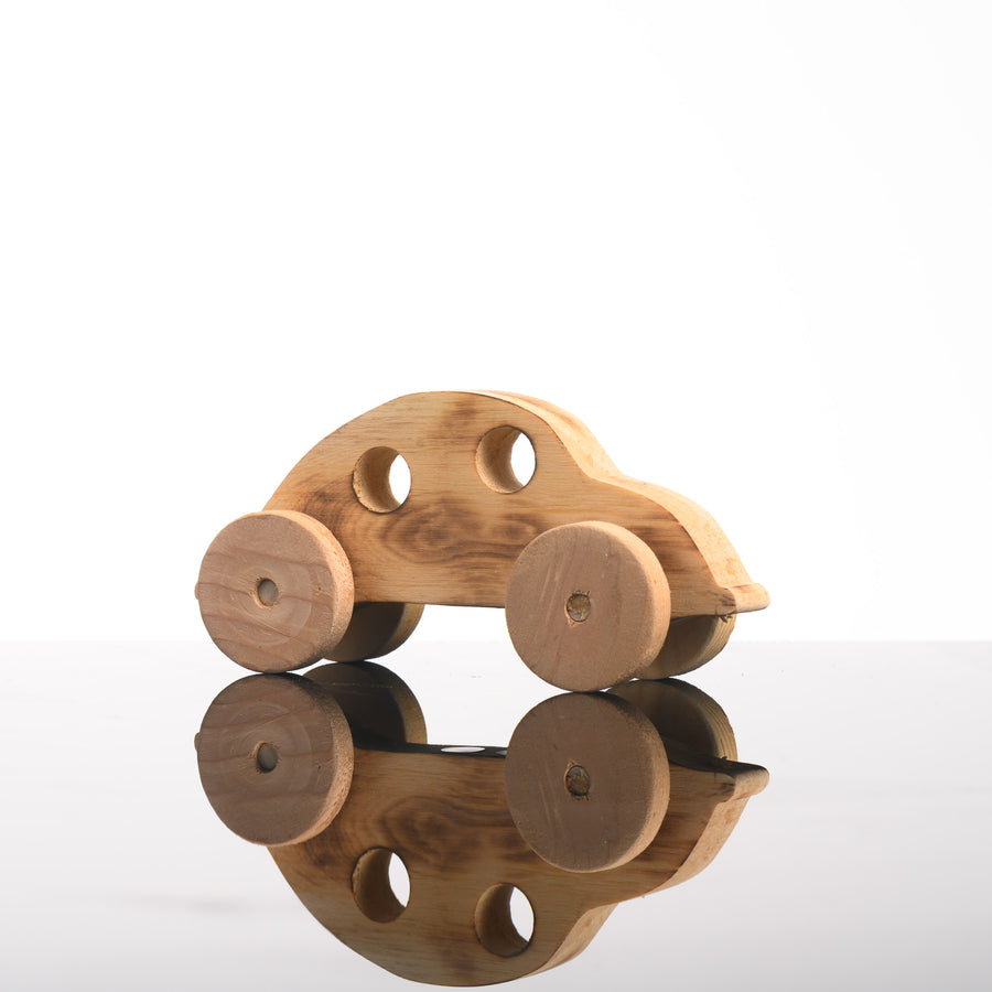 This cute wooden kids toy is a handmade representation of a vw bug.