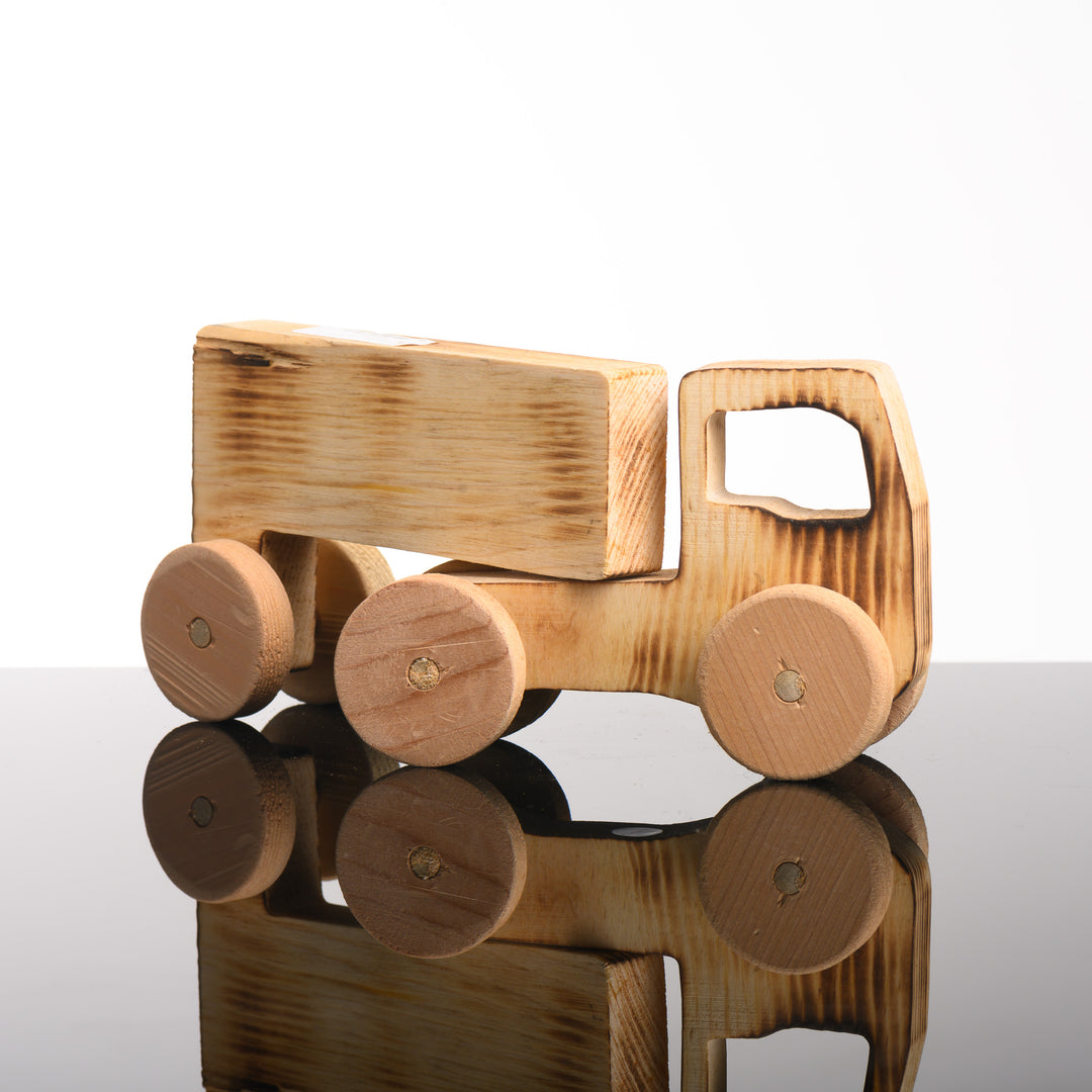 A handmade wooden semi-truck toy.