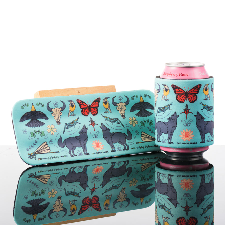 This light teal slap can cooler features colorful art inspired by the bison range in Montana.