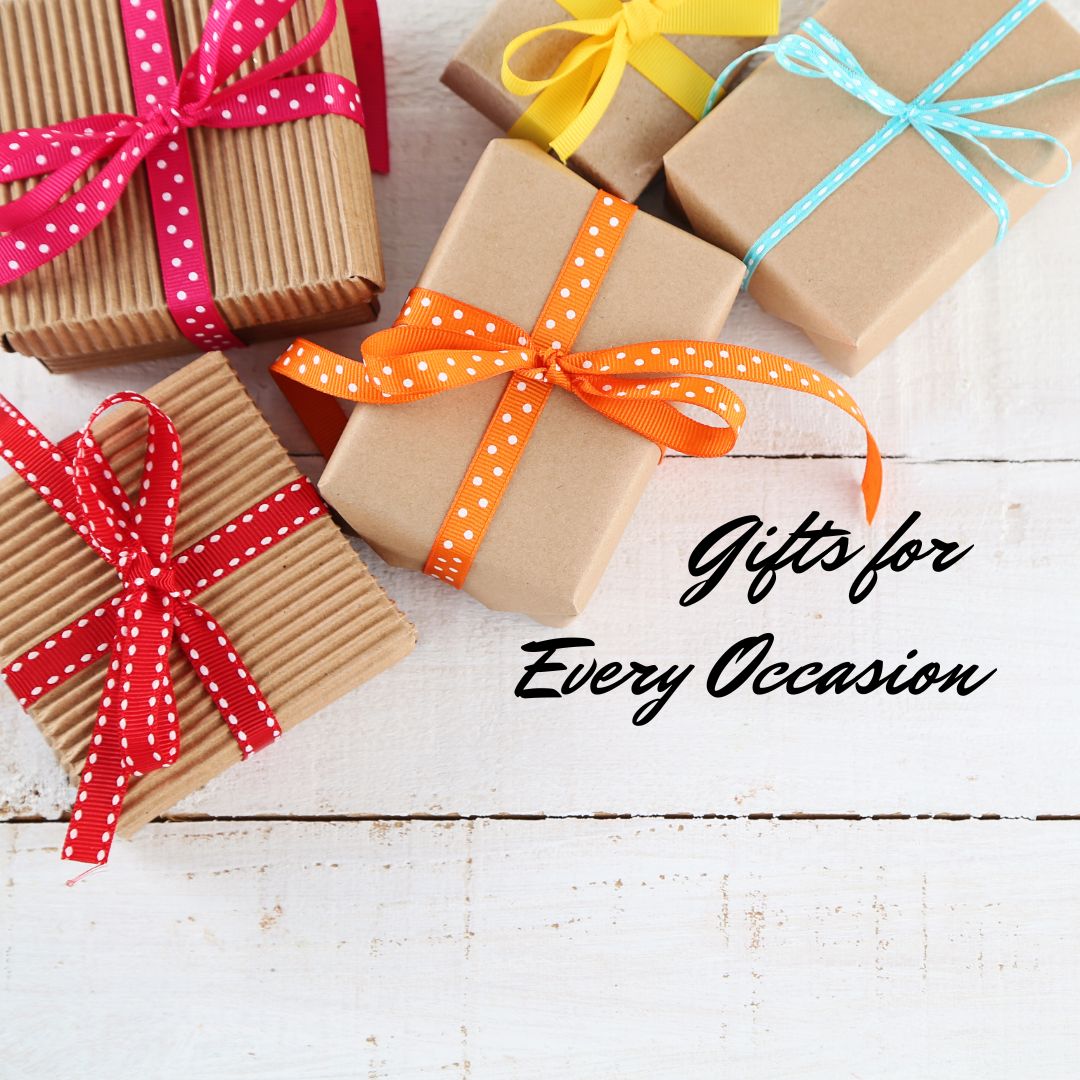 Gifts wrapped in kraft brown paper with colored ribbons, representing the Gifts for Every Occasion Collection of Montana-made merchandise available at The Last Best Store.