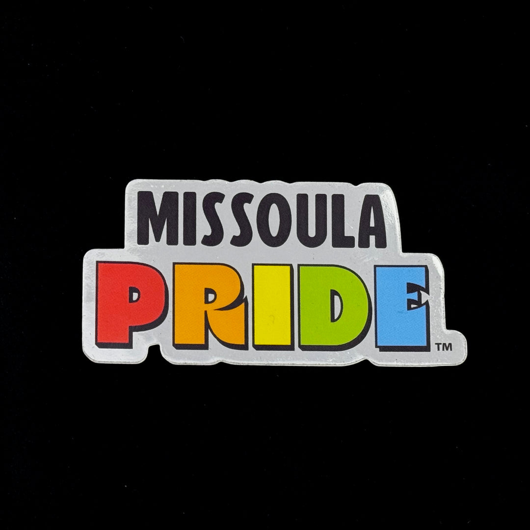 Single Missoula PRIDE sticker with "PRIDE" in rainbow tones, on a chrome background