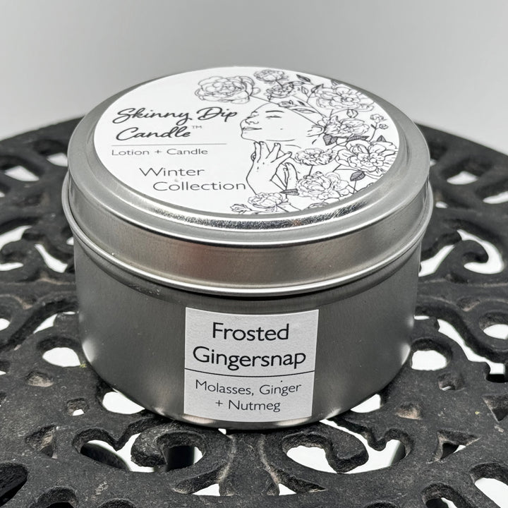 4 oz. tin of Skinny Dip Candle's Frosted Gingersnap Lotion Candle, front