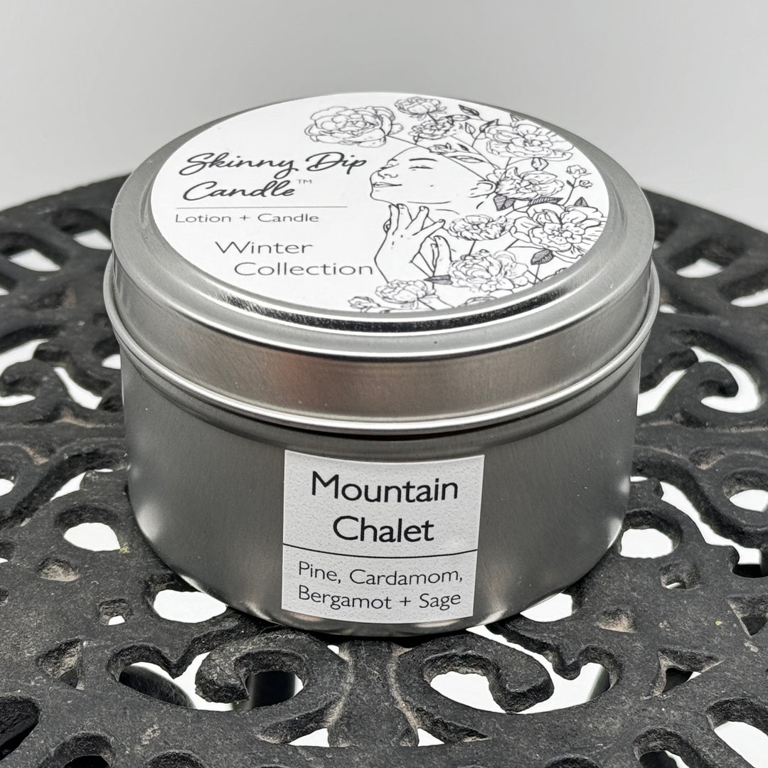 4 oz. tin of Skinny Dip Candle's Mountain Chalet Lotion Candle, front