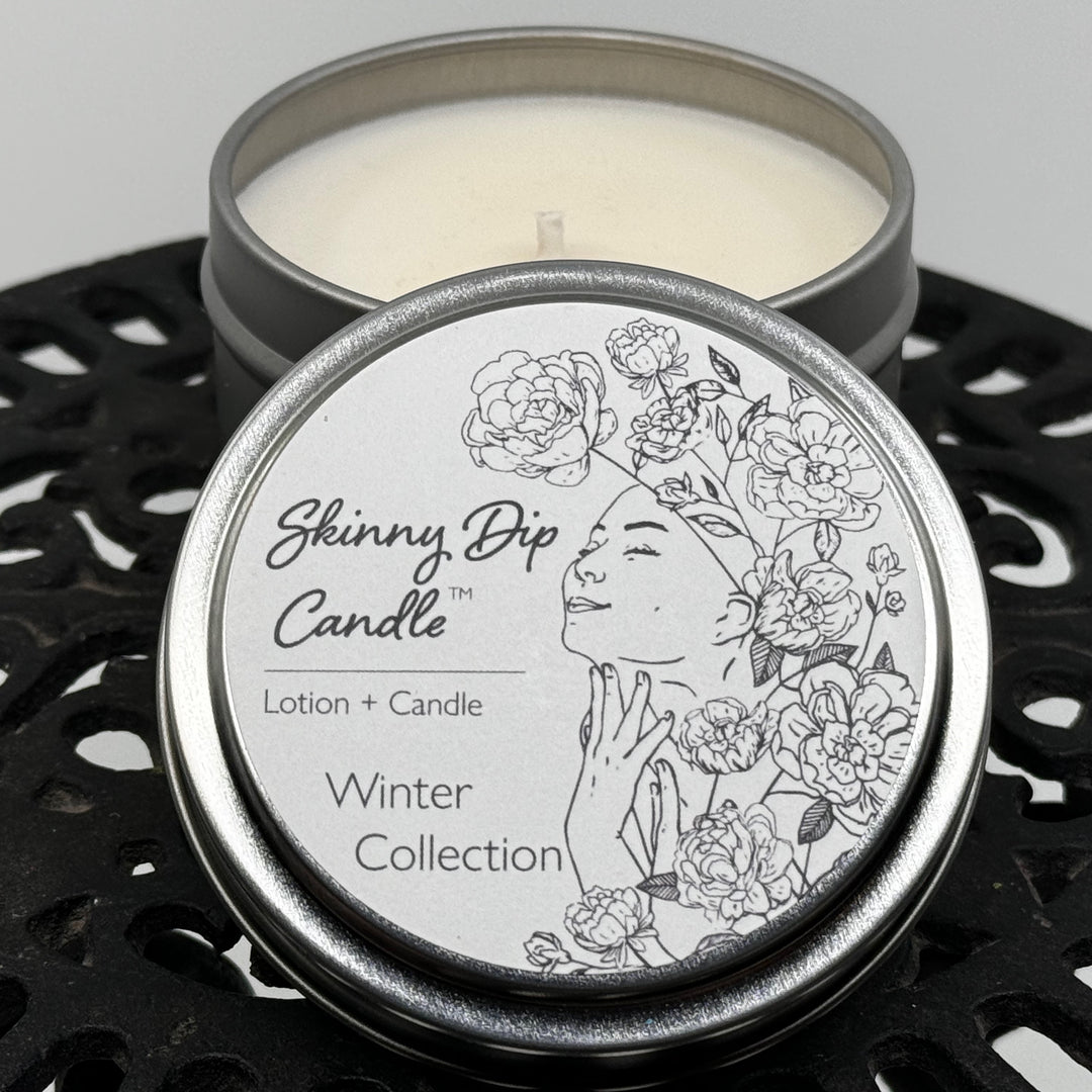 4 oz. tin of Skinny Dip Candle's Mountain Chalet Lotion Candle, lid and inside