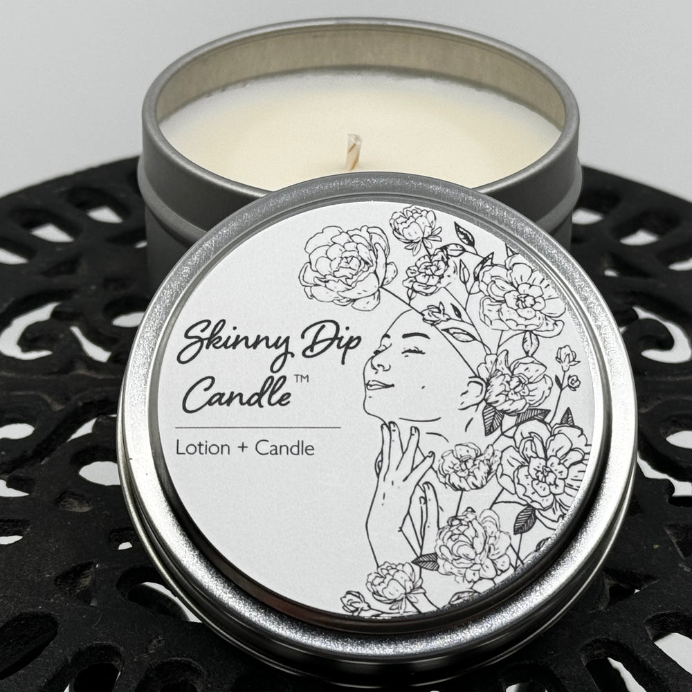 4 oz. tin of Skinny Dip Candle's Ginger & Juice Lotion Candle, lid and inside