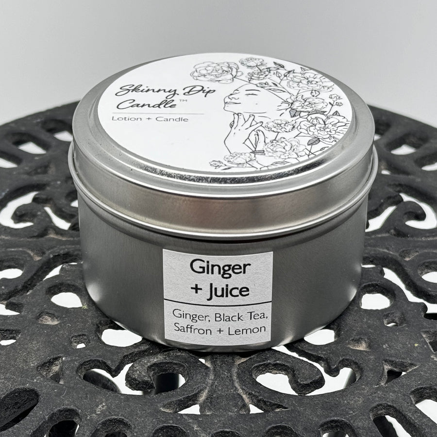 4 oz. tin of Skinny Dip Candle's Ginger & Juice Lotion Candle, front