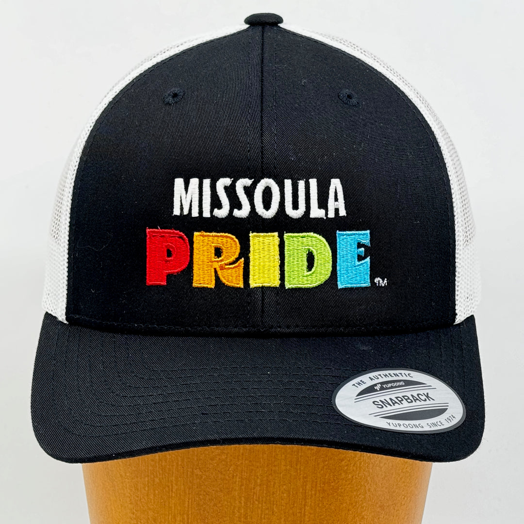 Black and White Retro Trucker Hat featuring the Missoula PRIDE logo, front