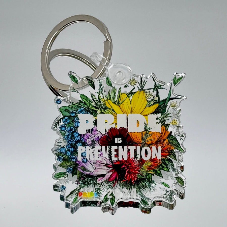 Keychain featuring the 2024 Missoula PRIDE design Pride is Prevention