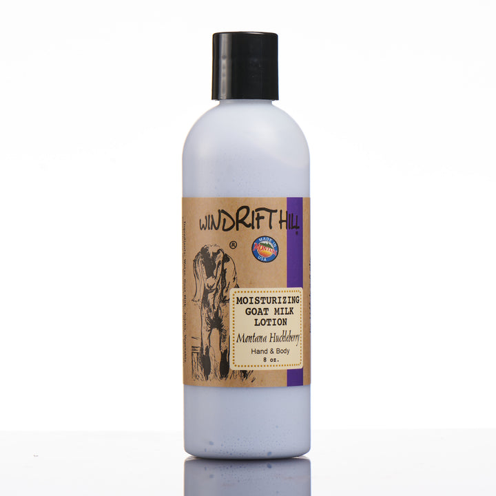 An 8 ounce bottle of Windrift Hill's made in Montana moisturizing goat milk lotion in scent Montana Huckleberry.