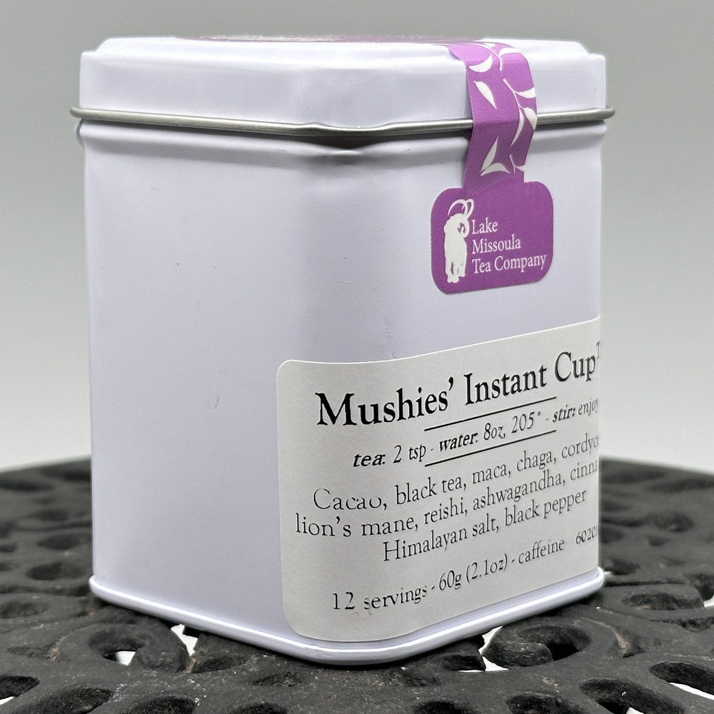 2.1 oz. tin of Lake Missoula Tea Company's Mushies' Instant Cup--the perfect gift of Montana mushroom tea; image depicts the side of the tin