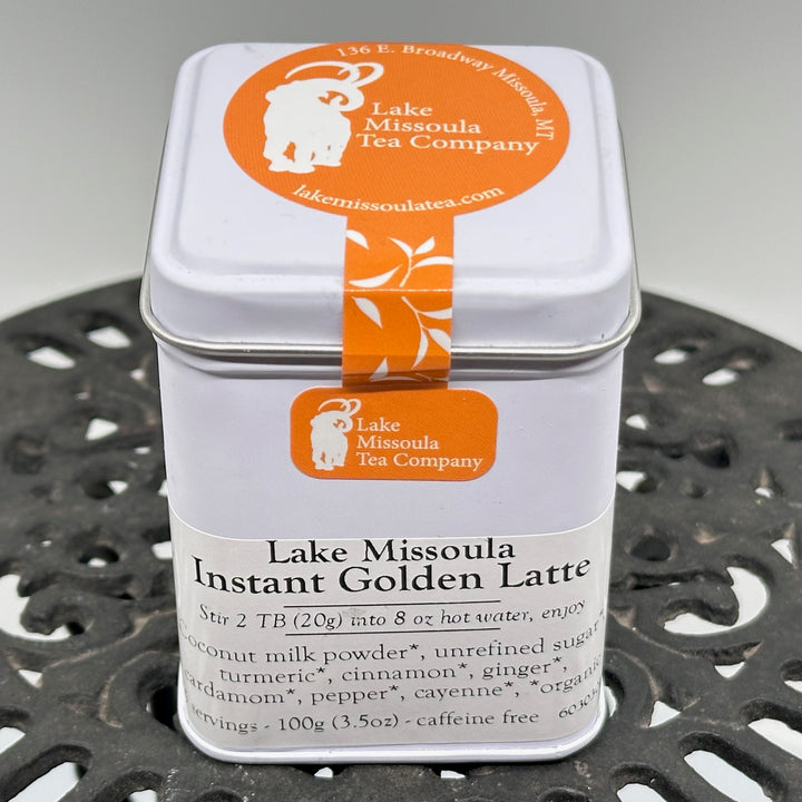 3.5 oz tin of Instant Golden Latte from Lake Missoula Tea Company—the perfect gift of Montana tea; image depicts the front and top of the tin