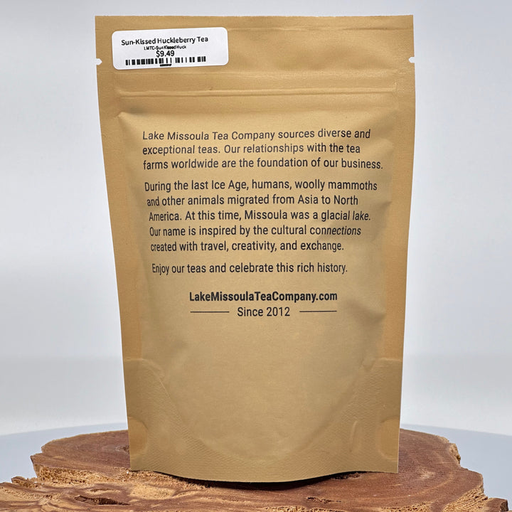 1.4 oz. bag of Lake Missoula Tea Co. Sun-Kissed Huckleberry Tea--the perfect gift of Montana tea; image depicts the back of the bag with product description