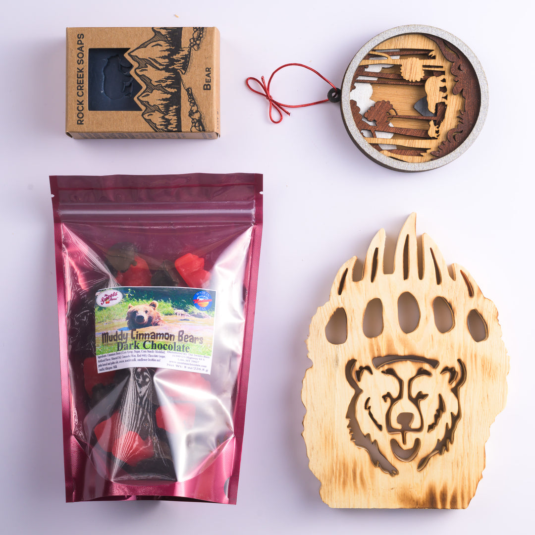 This Last Best Box features all made in Montana items including chocolate covered cinnamon gummy bears, Huckleberry soap with a bear stamp, a 3-D layered wood bear ornament and a wood bear paw with a bear face carved out of it.