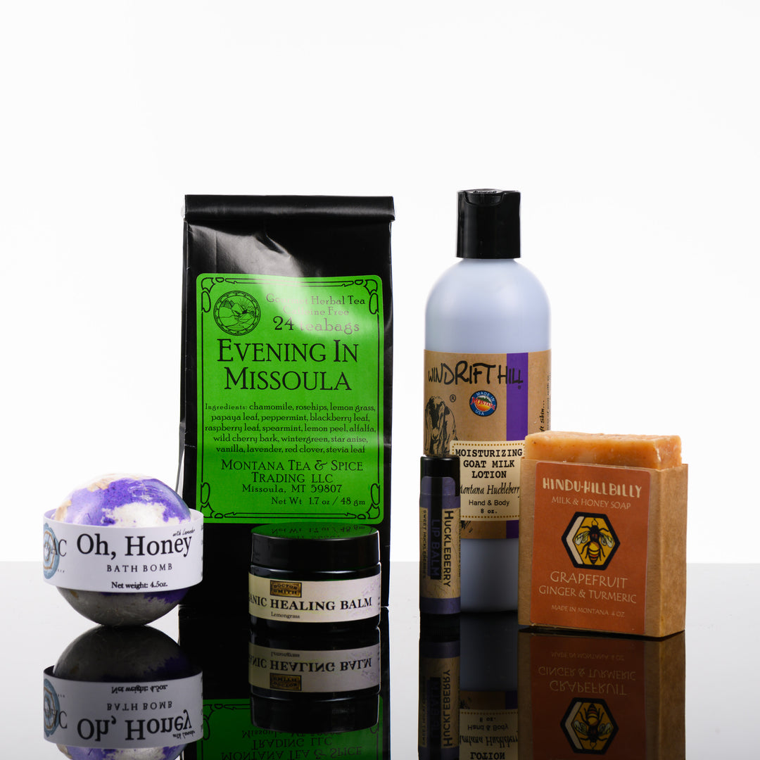 This Spa Gift Box is a curated collection of made in Montana goods featuring Evening in Missoula Tea, Lavender Bath Bomb, Montana Huckleberry Goat Milk Lotion, Huckleberry Lip Balm, Organic Healing Balm and a Hindu Hillbilly Soap.