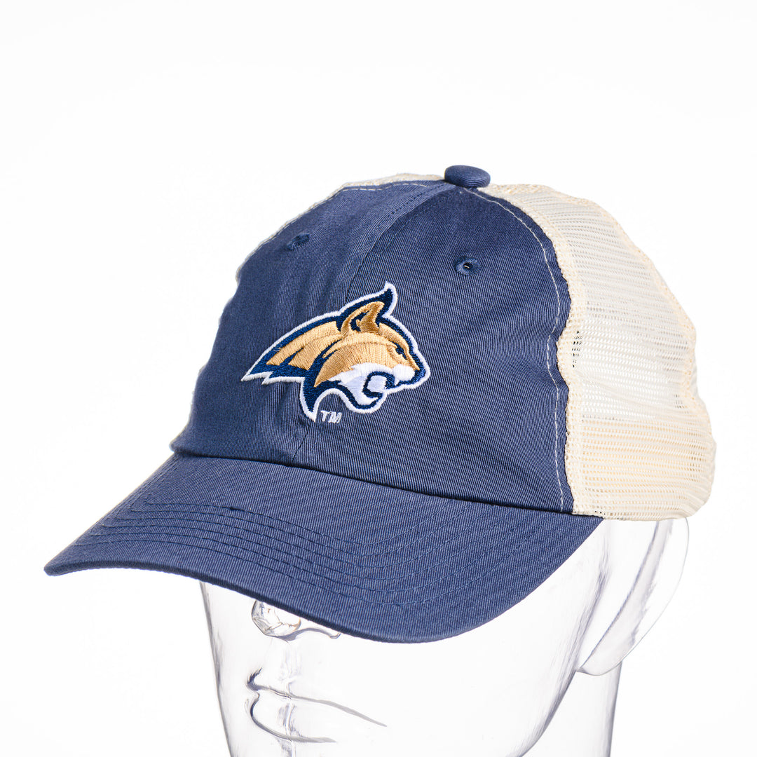 This denim blue and cream mesh trucker hat features a made in Montana embroidered Cat's Head logo.