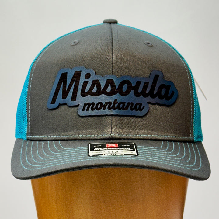 made in montana leather patch with missoula montana lettering. blue grey richardson trucker hat