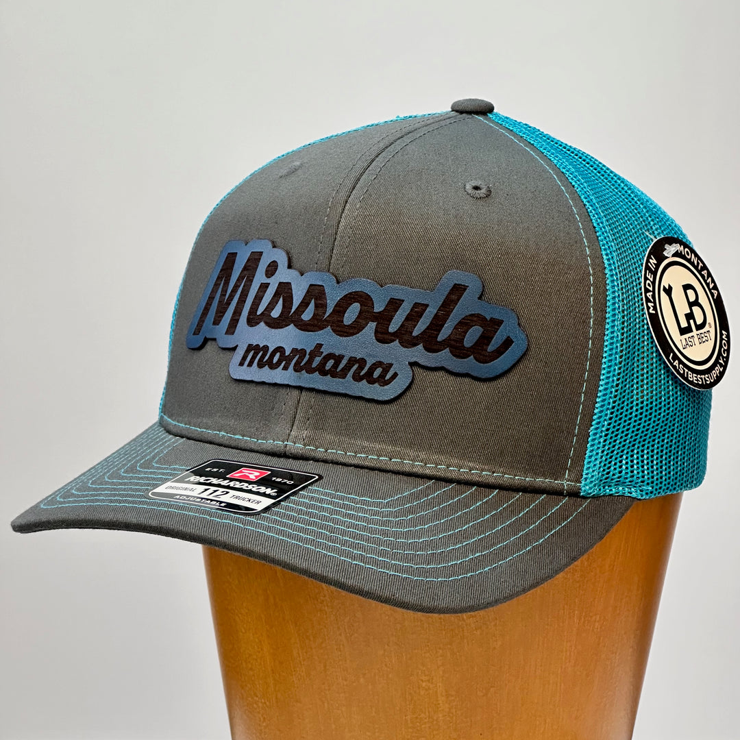 made in montana leather patch with missoula montana lettering. blue grey richardson trucker hat