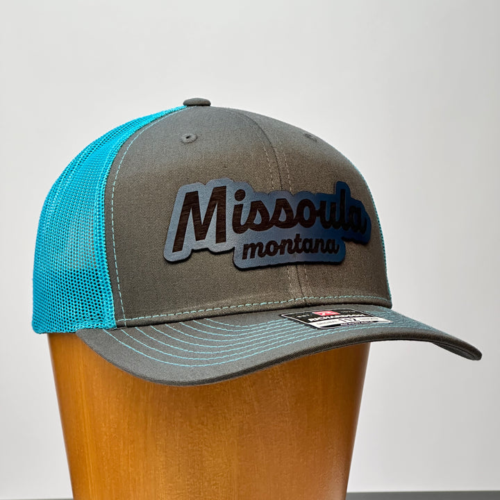 made in montana leather patch with missoula montana lettering. blue grey richardson trucker hat