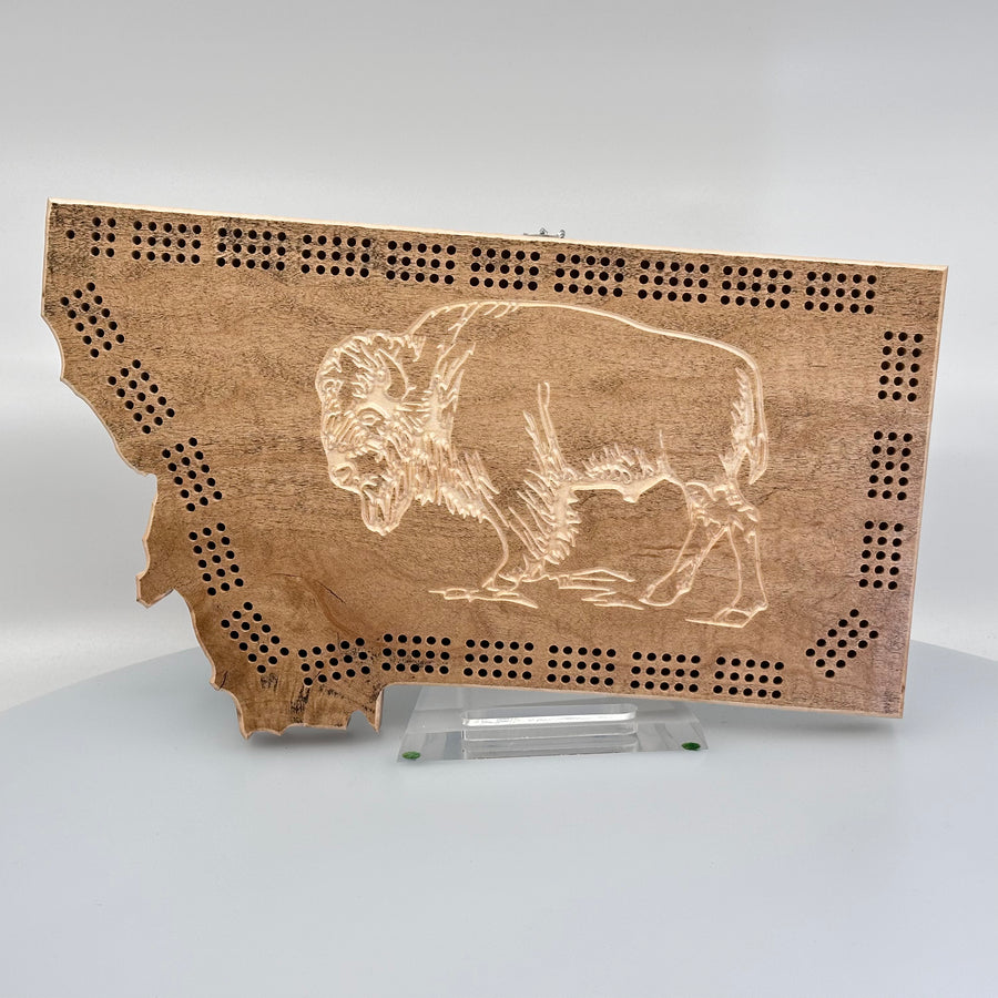 This made in Montana cribbage board features an engraved bison in a natural wood shape of Montana.