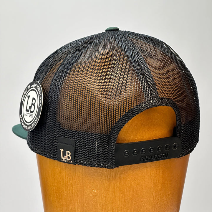 made in montana leather patch flatbill trucker hat. hand stitch