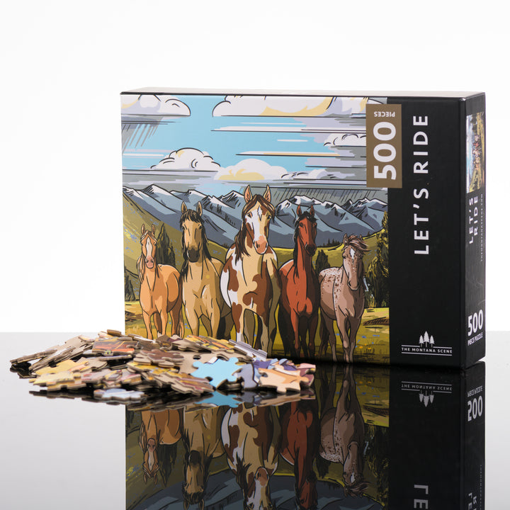 500-piece Let's Ride puzzle of horses in the foreground of a meadow and mountains, made in Montana by The Montana Scene; image depicts the box front with puzzle pieces.