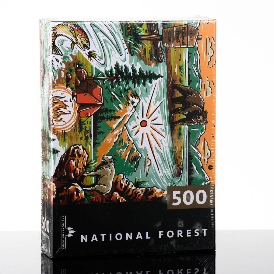 This hand drawn 500 piece puzzle by the Montana Scene features a bear, national forest sign, fly fishing, tent and mountain goat.