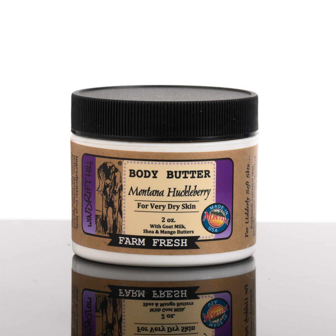 A 2 ounce container of Windrift Hill's Montana made body butter in sent Montana Huckleberry. For very dry skin, farm fresh.