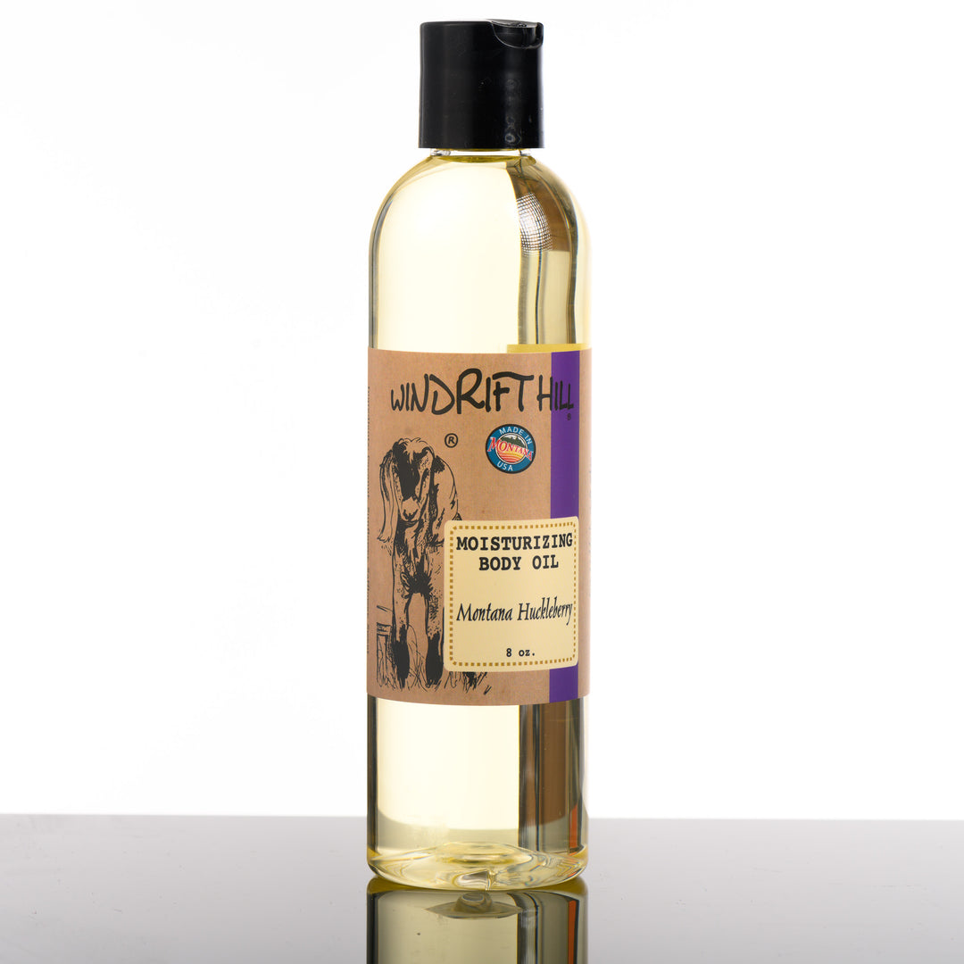 An 8 ounce bottle of Windrift Hills, Montana made, Montana Huckleberry moisturizing body oil.