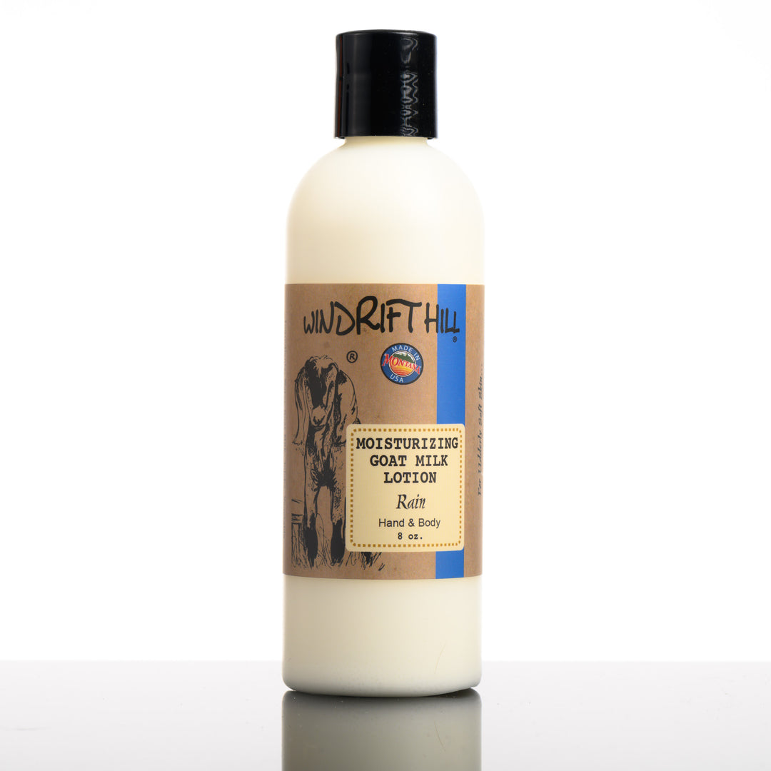 An 8 ounce bottle of Windrift Hill's made in Montana moisturizing goat milk lotion in scent rain.