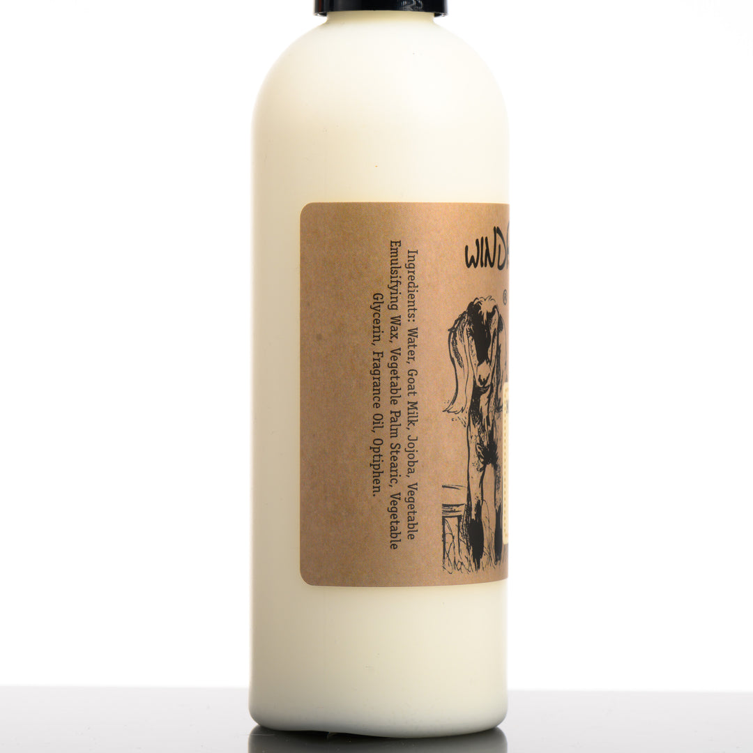 An 8 ounce bottle of Windrift Hill's made in Montana moisturizing goat milk lotion in scent rain. Water, Goat Milk, Jojoba, Vegetable Emulsifying Wax, Vegetable Palm Stearic, Vegetable Glycerin, Fragrance Oil, Optiphen