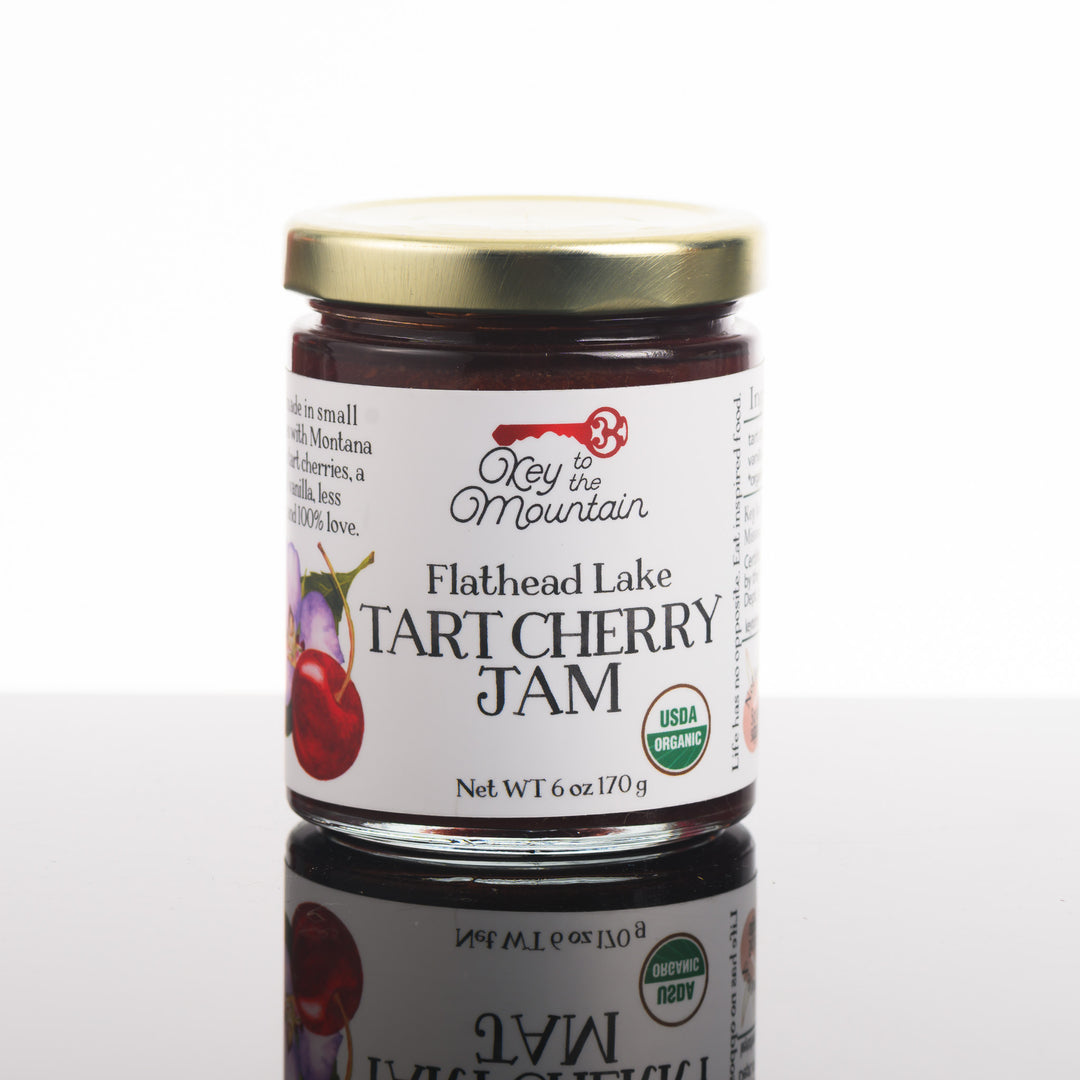 The front of a jar of Flathead Lake tart cherry jam made in Montana by Key to the Mountain.