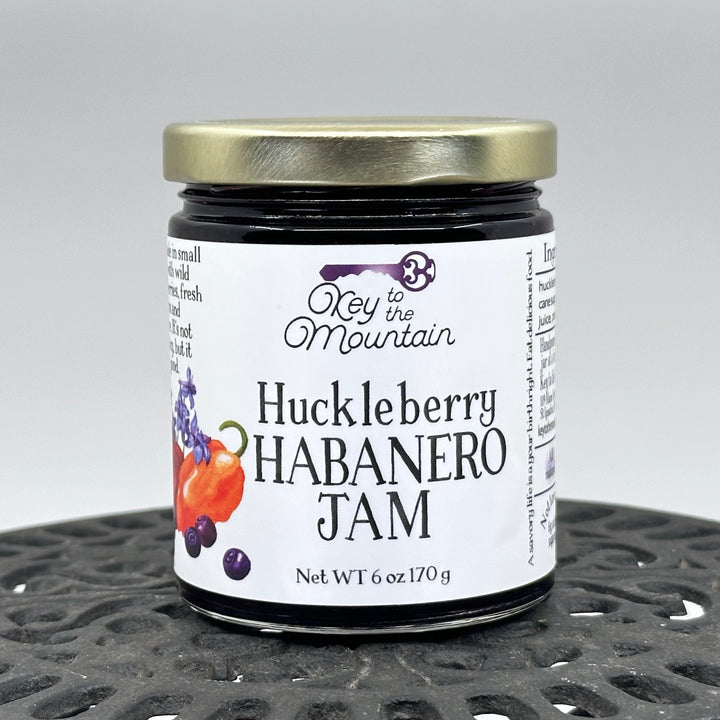 6 oz. jar of Key to the Mountain's Montana Made Huckleberry Habanero Jam, front