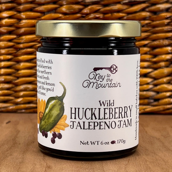 A 6oz jar of Key to the Mountain's Montana made Wild Huckleberry Jalepeno Jam.