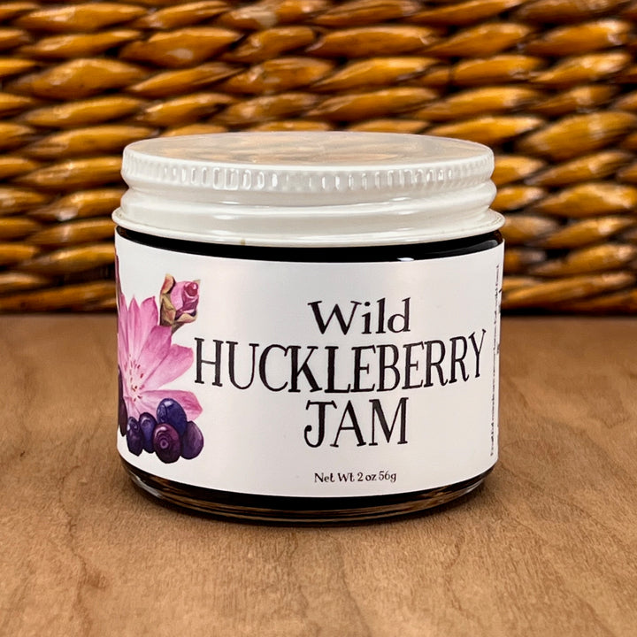 A 2oz jar of Key to the Mountain's, Montana handmade Wild Huckleberry Jam.