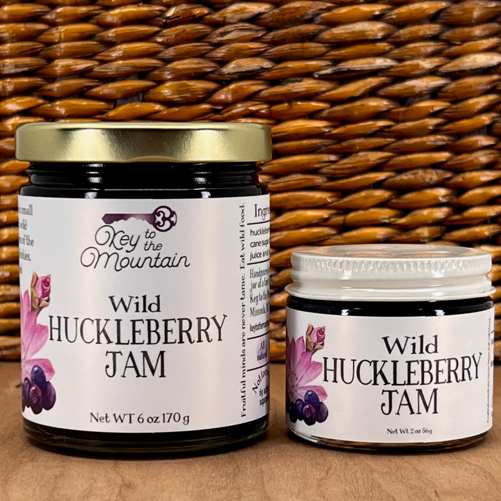 Two jars of Key to the Mountain's, Montana handmade Wild Huckleberry Jam.